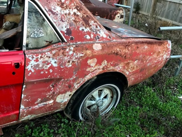 1965 red Ford Mustang Coupe