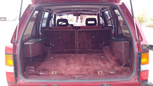 1990 Burgundy Nissan Pathfinder SUV