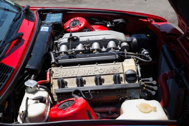 1988 red BMW M3 Coupe