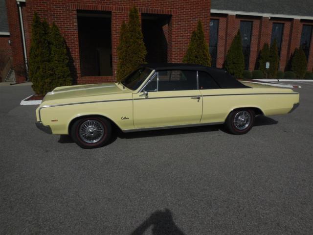 1964 Yellow Oldsmobile Cutlass Convertible