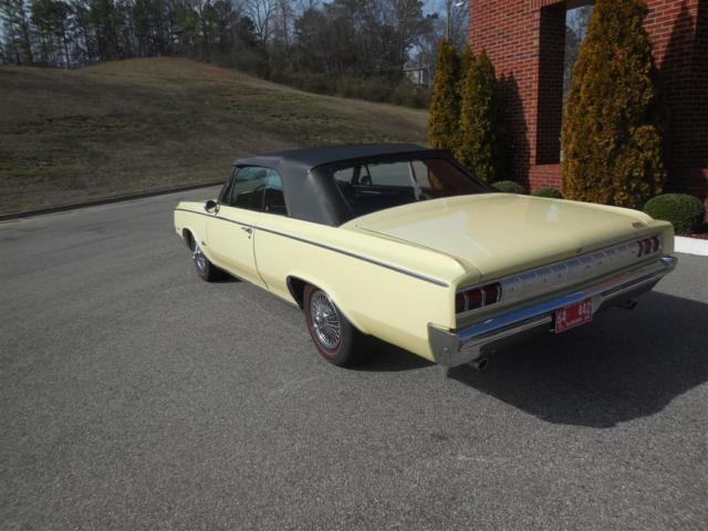 1964 Yellow Oldsmobile Cutlass Convertible