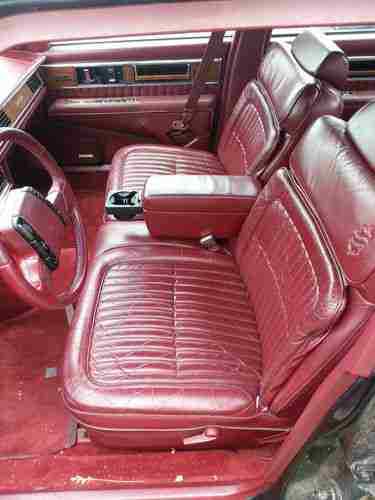 1990 Red Oldsmobile Ninety-Eight Sedan