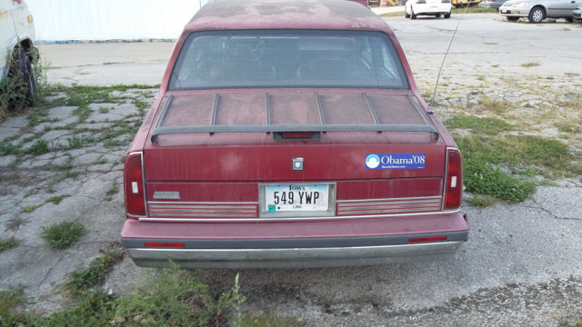 1990 Red Oldsmobile Ninety-Eight Sedan