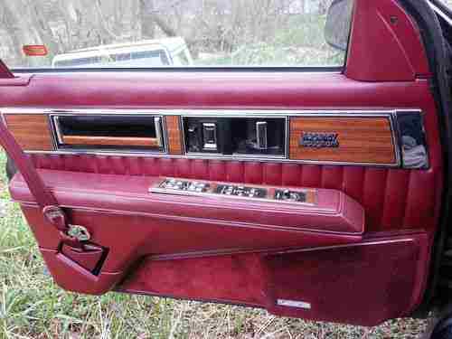 1990 Red Oldsmobile Ninety-Eight Sedan