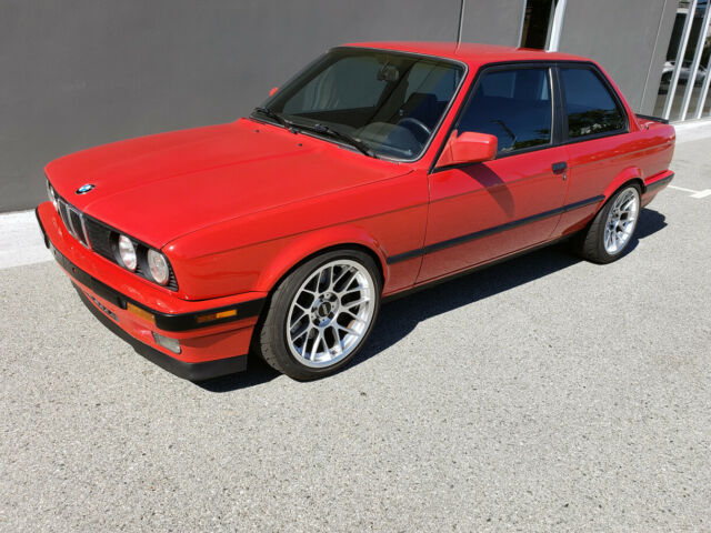1991 red BMW 3-Series two door sedan