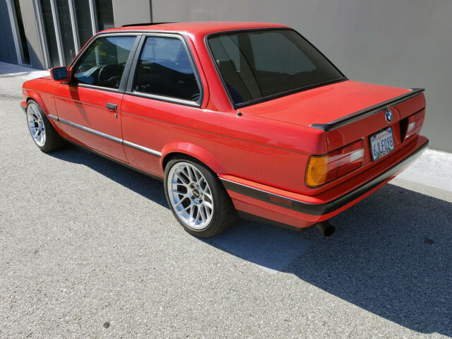 1991 red BMW 3-Series two door sedan