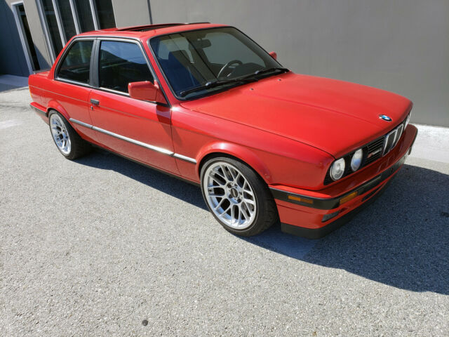 1991 red BMW 3-Series two door sedan