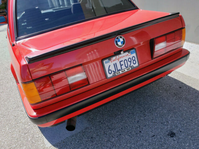 1991 red BMW 3-Series two door sedan