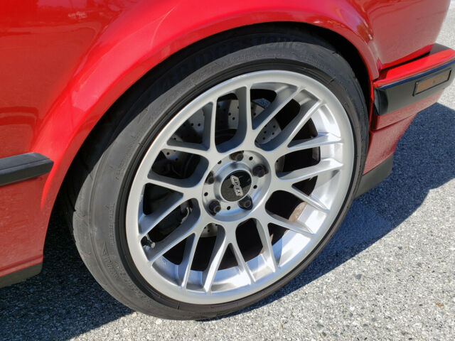 1991 red BMW 3-Series two door sedan