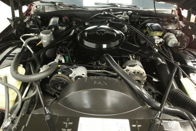 1990 Red Cadillac Brougham Sedan