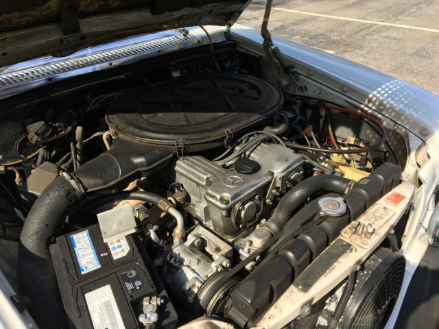 1974 White Mercedes-Benz 200-Series Sedan