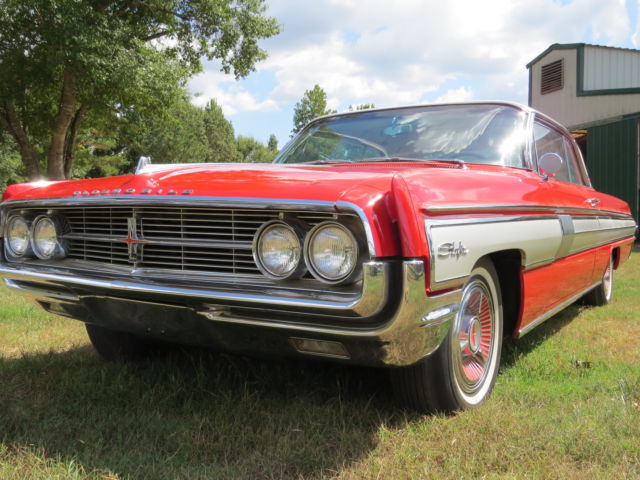 1962 Red/White top Oldsmobile Starfire Coupe
