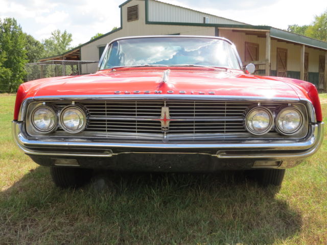 1962 Red/White top Oldsmobile Starfire Coupe