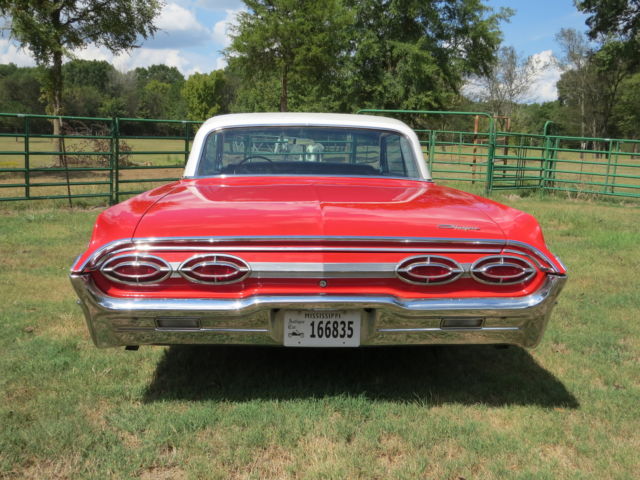 1962 Red/White top Oldsmobile Starfire Coupe