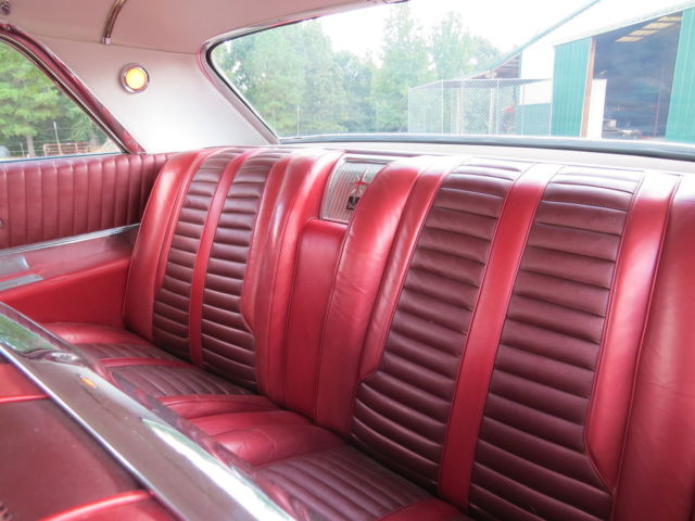 1962 Red/White top Oldsmobile Starfire Coupe