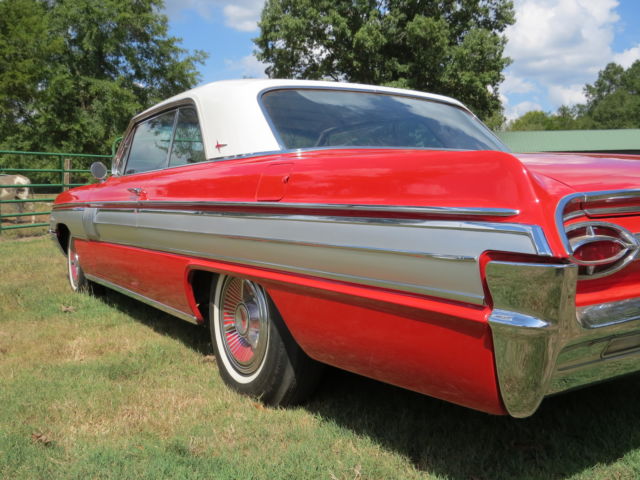 1962 Red/White top Oldsmobile Starfire Coupe