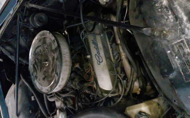 1966 Blue, Black,and a line of yellow Cadillac DeVille Coupe