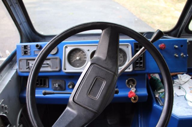 1987 Blue and white stripped Chevrolet P30 Series Box truck