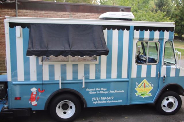 1987 Blue and white stripped Chevrolet P30 Series Box truck