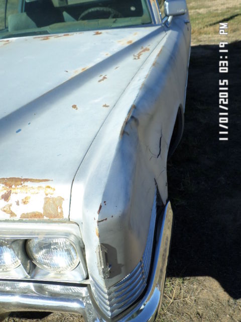 1970 silver Cadillac DeVille Coupe