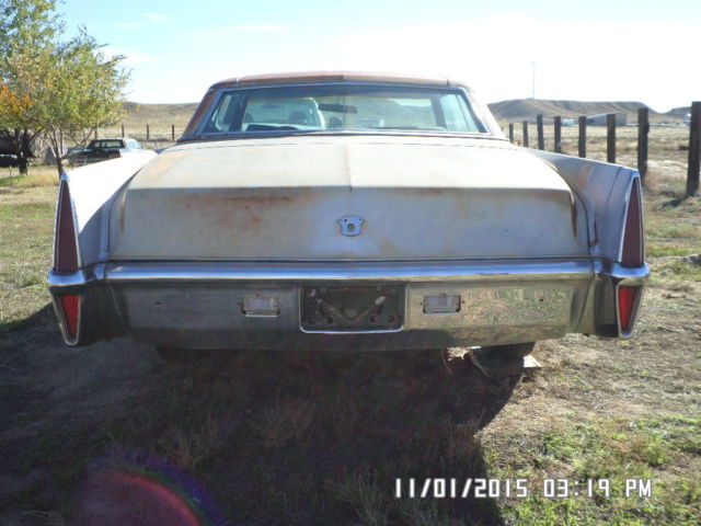 1970 silver Cadillac DeVille Coupe