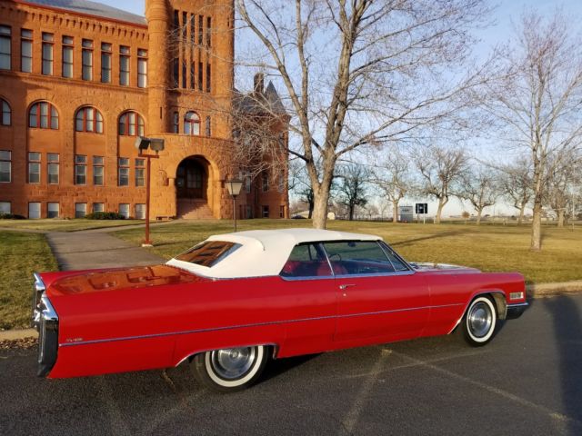 1966 red Cadillac DeVille Convertible