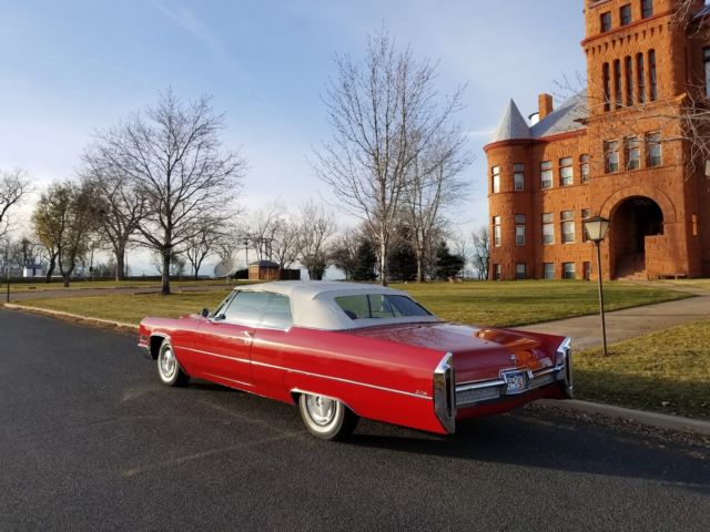 1966 red Cadillac DeVille Convertible