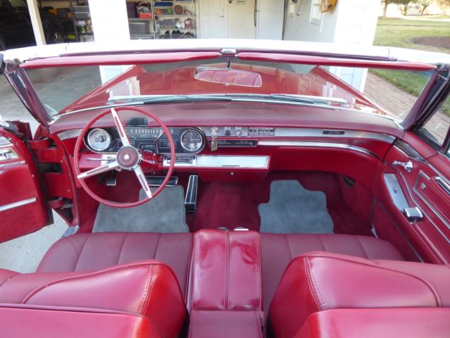 1966 red Cadillac DeVille Convertible