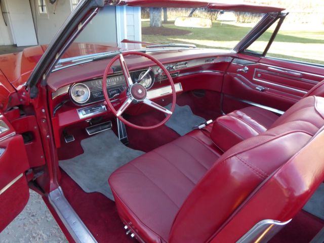 1966 red Cadillac DeVille Convertible