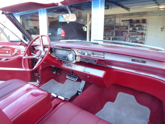 1966 red Cadillac DeVille Convertible