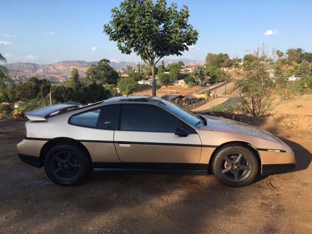 1987 Gold Pontiac Fiero Coupe