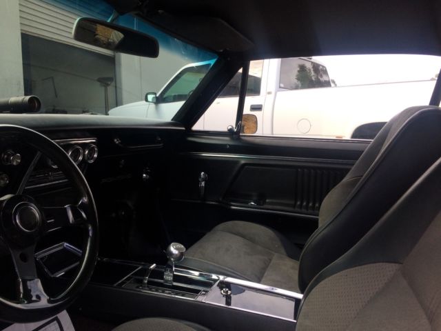 1967 Silver/BlackTop Pontiac Firebird 2 door.