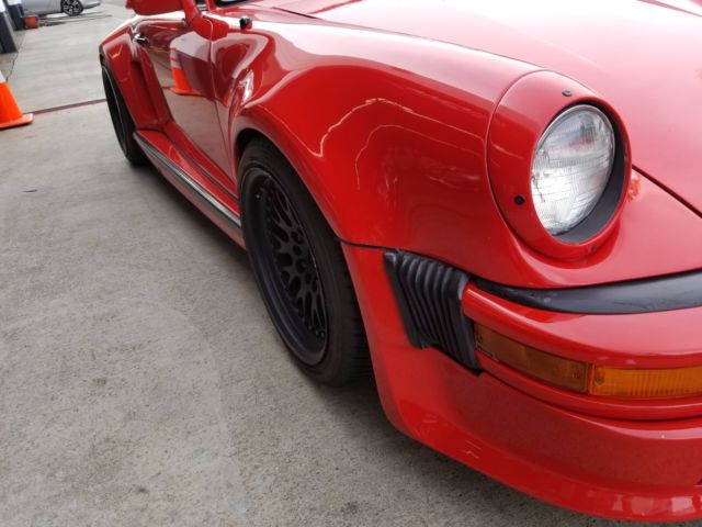 1979 red Porsche 911 Coupe