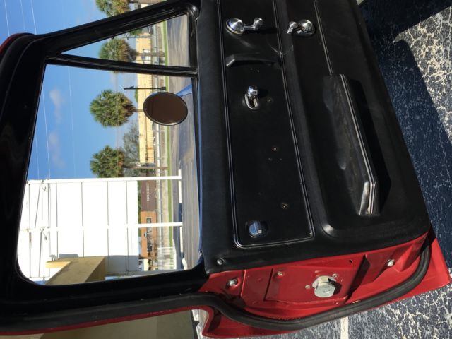 1965 maroon Chevrolet Corvette Coupe