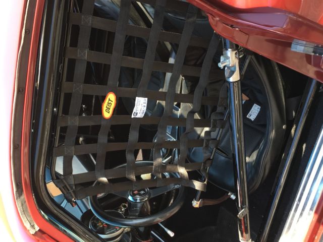 1965 maroon Chevrolet Corvette Coupe