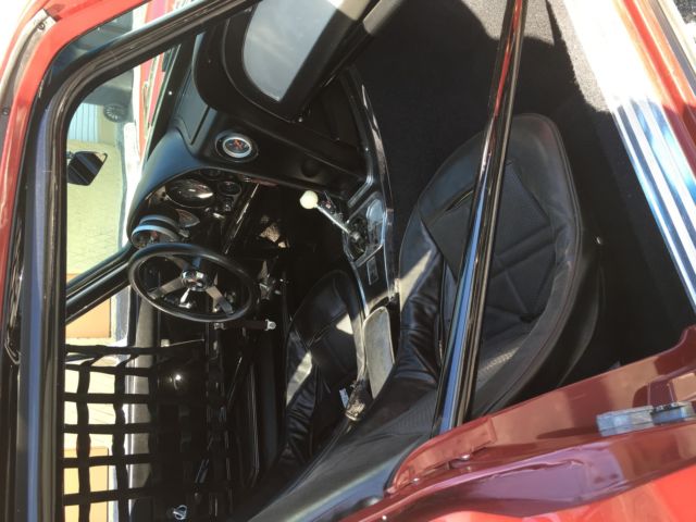 1965 maroon Chevrolet Corvette Coupe