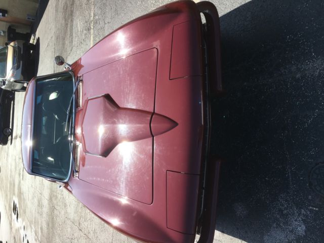 1965 maroon Chevrolet Corvette Coupe