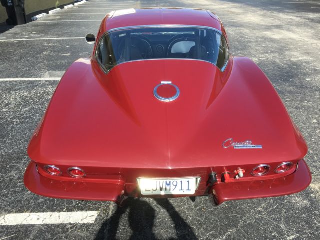 1965 maroon Chevrolet Corvette Coupe