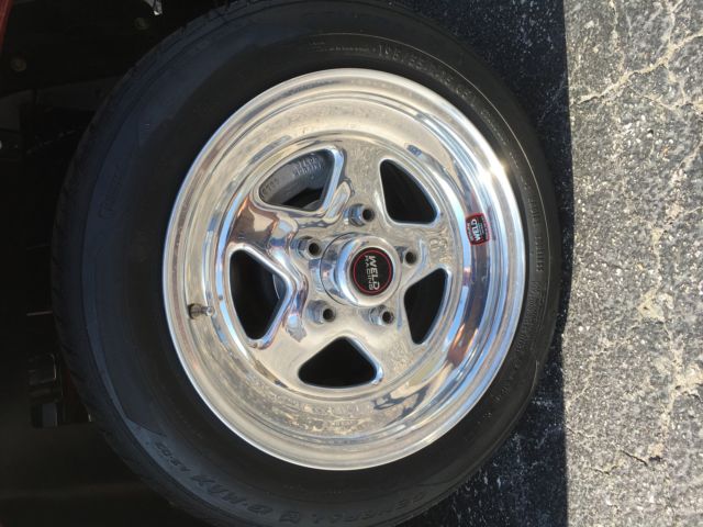 1965 maroon Chevrolet Corvette Coupe