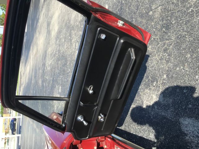 1965 maroon Chevrolet Corvette Coupe