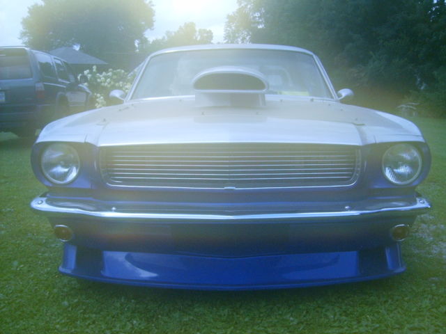 1965 blue/silver Ford Mustang Coupe