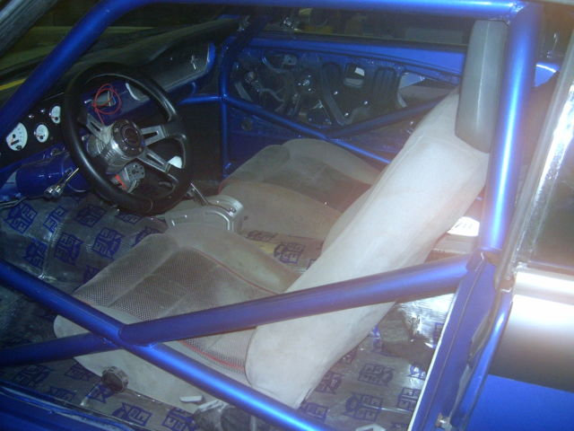 1965 blue/silver Ford Mustang Coupe