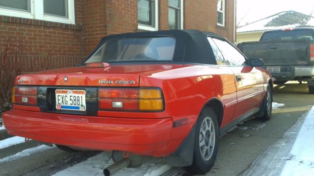 1989 red Toyota celica Convertible