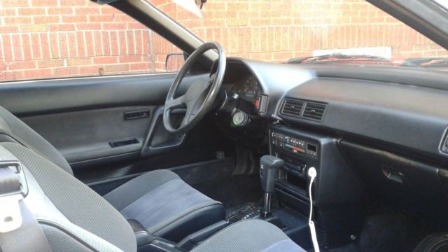 1989 red Toyota celica Convertible