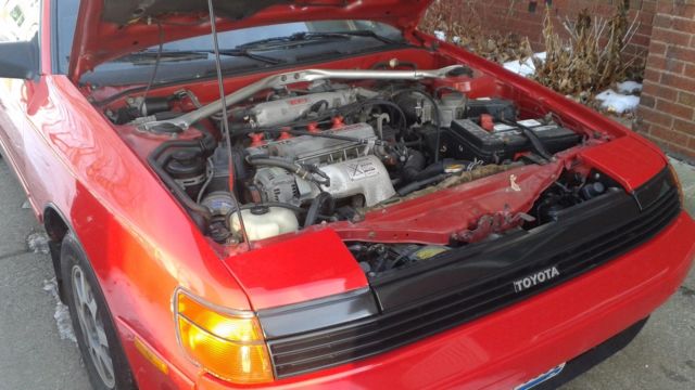 1989 red Toyota celica Convertible