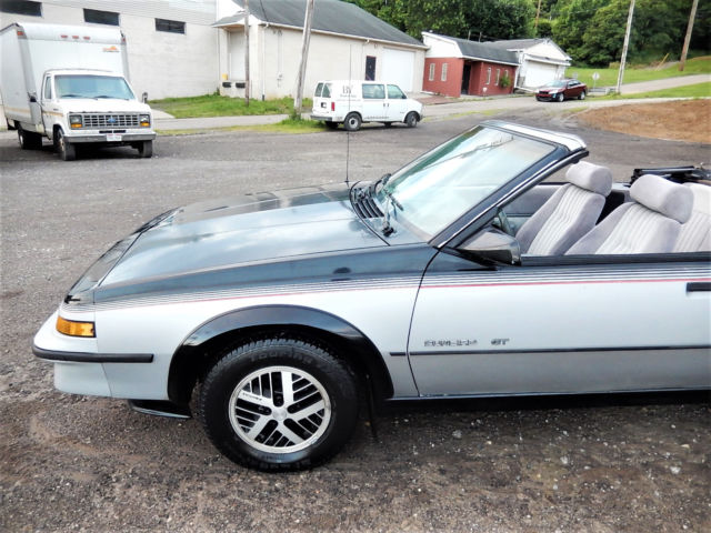 1986 Black/Silver Pontiac Sunbird Convertible