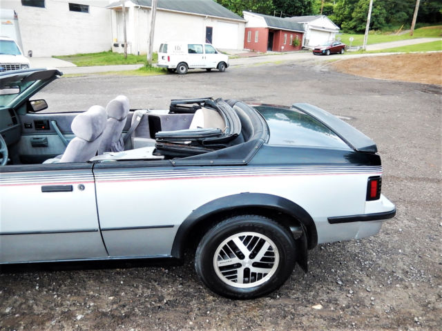 1986 Black/Silver Pontiac Sunbird Convertible