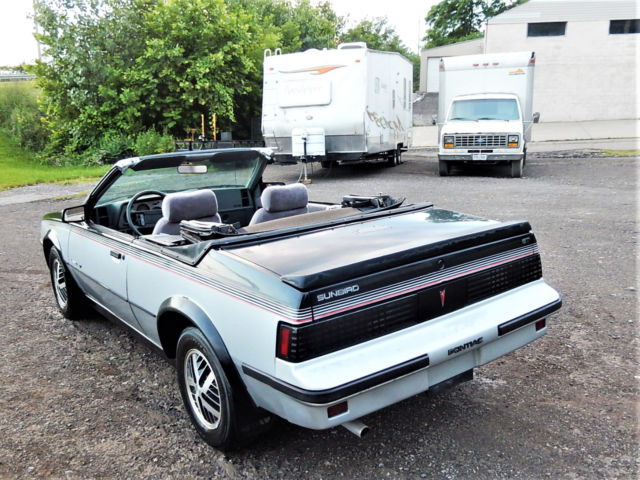 1986 Black/Silver Pontiac Sunbird Convertible