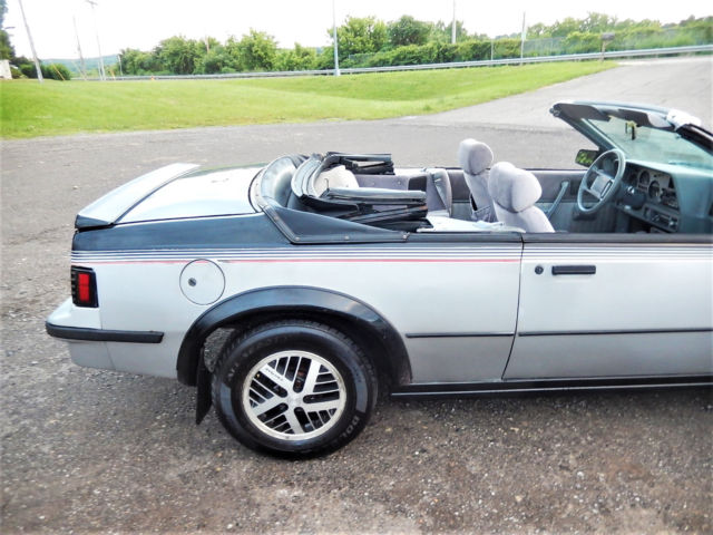 1986 Black/Silver Pontiac Sunbird Convertible