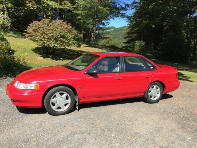 1994 Red Ford Taurus Sedan